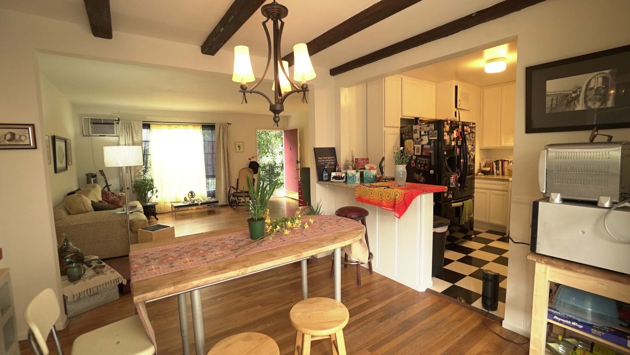 Dining and living area opening into kitchen