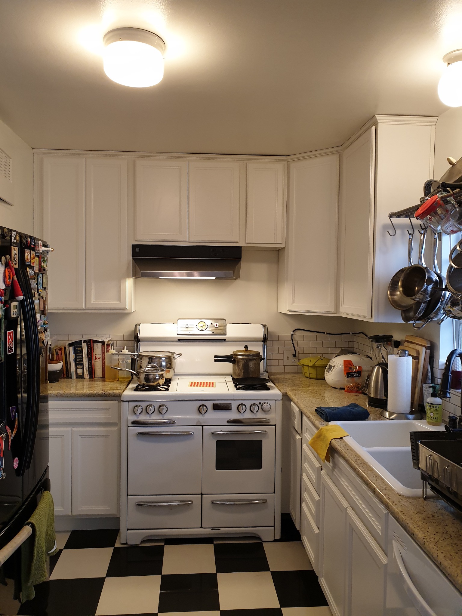 Chef-level kitchen with vintage range and checkerboard flooring