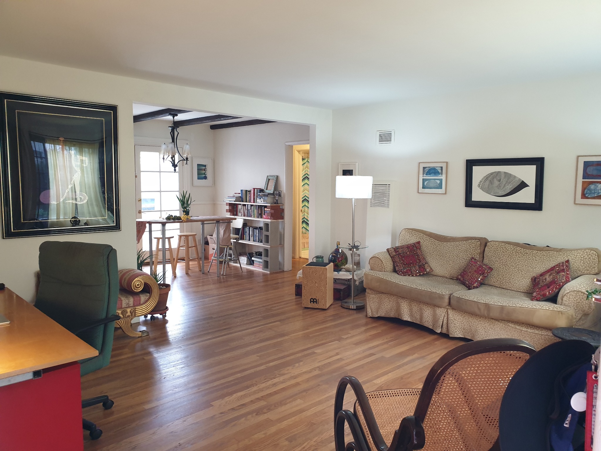 Warm living room with hardwood floors and vintage character